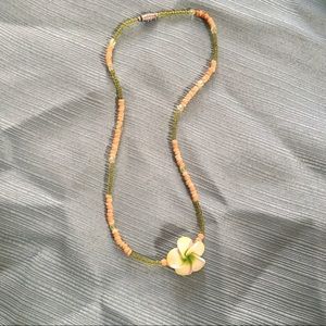 Green and tan flower necklace.